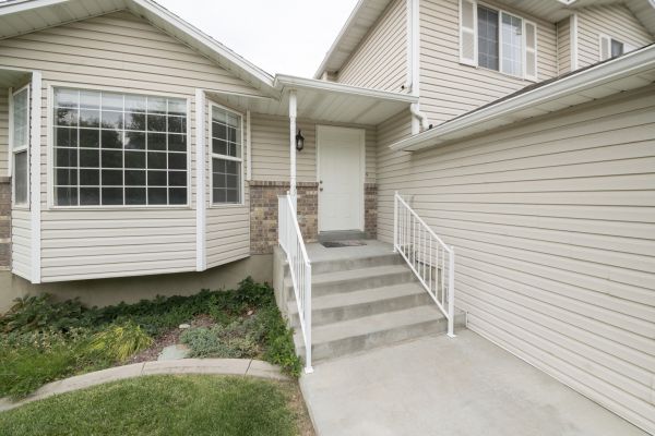 White Vinyl Siding Replacement in Utica