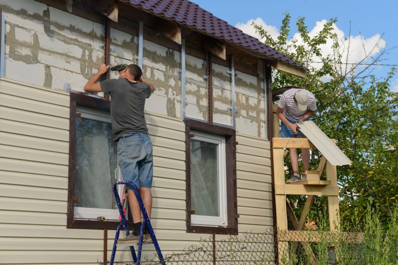 Siding Contractors Working on a House